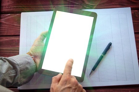 Digital tablet computer with isolated screen in male handsの写真素材