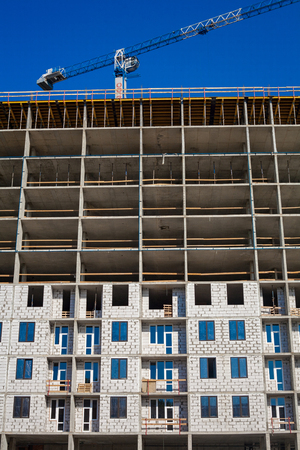 Construction of apartment buildings with the help of large tower cranes ...