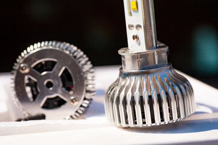 Light bulbs for car lamps. Automotive part in Silvery metallic and black color with wires and connecting elementsの写真素材