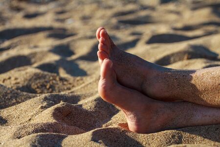 young girl's toes are healthy and beautiful. Well-groomed toes. Concept for medical articles and ointments - the image of the toes and feet. Image of legs with space for inscriptions and advertising.の写真素材