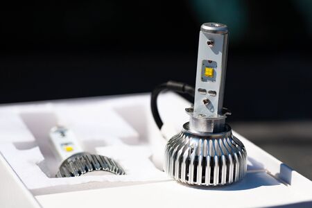 Light bulbs for car lamps. Automotive part in Silvery metallic and black color with wires and...