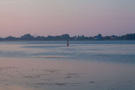 Morning on the river early morning reeds mist fog and water surface on the riverの写真素材