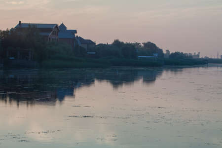 Morning on the river early morning reeds mist fog and water surface on the riverの写真素材