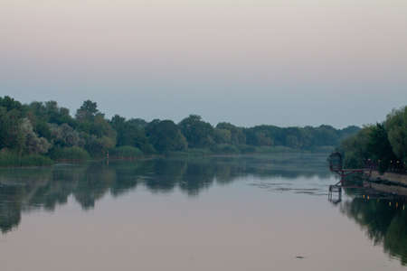 Morning on the river early morning reeds mist fog and water surface on the riverの写真素材