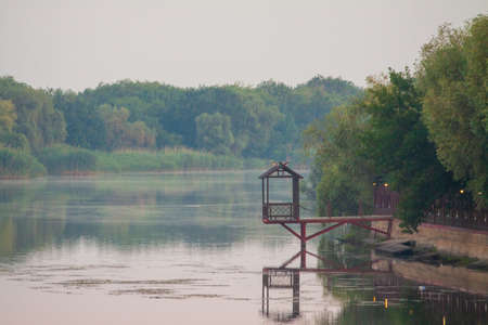 Morning on the river early morning reeds mist fog and water surface on the riverの写真素材