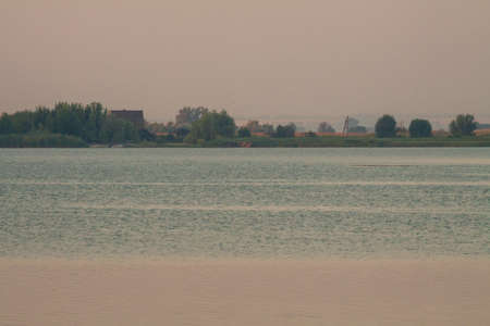 Morning on the river early morning reeds mist fog and water surface on the riverの写真素材