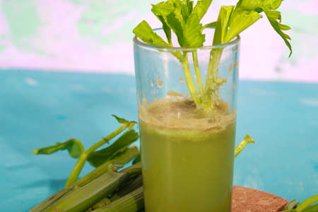 Healthy Celery diet for the treatment of incurable mysterious diseases. Fresh celery juice squeezed out on a juicer.drink, vegetable juice, studio shotの写真素材