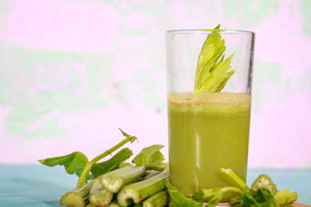 Healthy Celery diet for the treatment of incurable mysterious diseases. Fresh celery juice squeezed out on a juicer.drink, vegetable juice, studio shotの写真素材