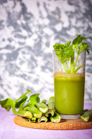 Healthy Celery diet for the treatment of incurable mysterious diseases. Fresh celery juice squeezed out on a juicer.drink, vegetable juice, studio shotの写真素材