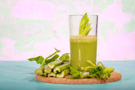 Healthy Celery diet for the treatment of incurable mysterious diseases. Fresh celery juice squeezed out on a juicer.drink, vegetable juice, studio shotの写真素材