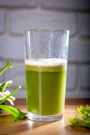 Healthy Celery diet for the treatment of incurable mysterious diseases. Fresh celery juice squeezed out on a juicer.drink, vegetable juice, studio shotの写真素材