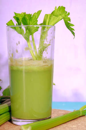 Healthy Celery diet for the treatment of incurable mysterious diseases. Fresh celery juice squeezed out on a juicer.drink, vegetable juice, studio shotの写真素材