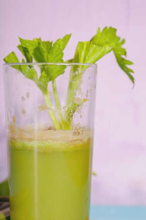 Healthy Celery diet for the treatment of incurable mysterious diseases. Fresh celery juice squeezed out on a juicer.drink, vegetable juice, studio shotの写真素材