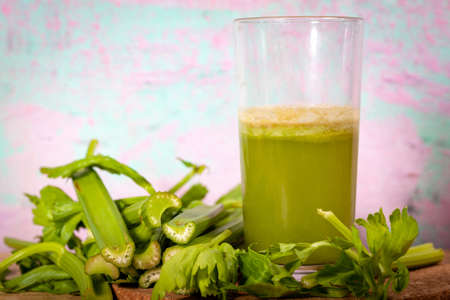 Healthy Celery diet for the treatment of incurable mysterious diseases. Fresh celery juice squeezed out on a juicer.drink, vegetable juice, studio shotの写真素材
