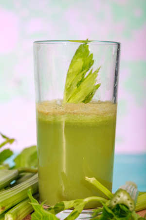 Healthy Celery diet for the treatment of incurable mysterious diseases. Fresh celery juice squeezed out on a juicer.drink, vegetable juice, studio shotの写真素材