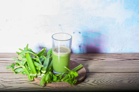 Healthy Celery diet for the treatment of incurable mysterious diseases. Fresh celery juice squeezed out on a juicer.drink, vegetable juice, studio shotの写真素材