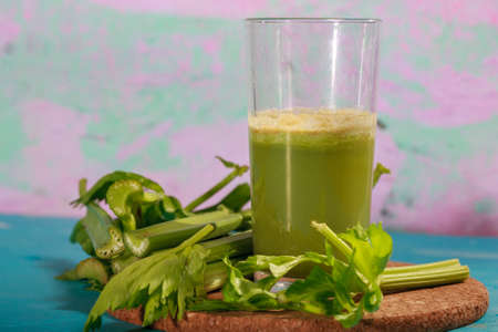 Healthy Celery diet for the treatment of incurable mysterious diseases. Fresh celery juice squeezed out on a juicer.drink, vegetable juice, studio shotの写真素材