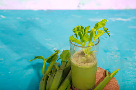 Healthy Celery diet for the treatment of incurable mysterious diseases. Fresh celery juice squeezed out on a juicer.drink, vegetable juice, studio shotの写真素材