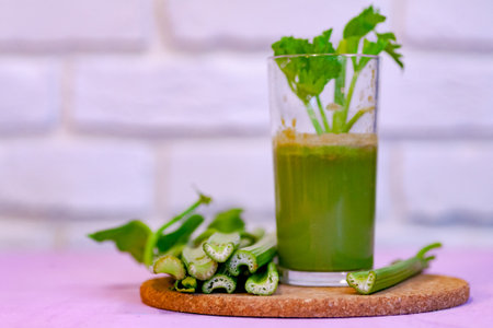Healthy Celery diet for the treatment of incurable mysterious diseases. Fresh celery juice squeezed out on a juicer.drink, vegetable juice, studio shotの写真素材