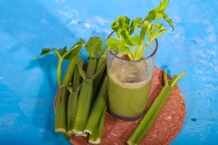 Healthy Celery diet for the treatment of incurable mysterious diseases. Fresh celery juice squeezed out on a juicer.drink, vegetable juice, studio shotの写真素材