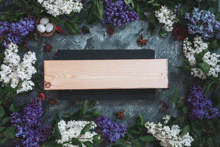 Background for greeting card greeting beloved woman wedding invitation flowers lilac on wooden surfaceの写真素材