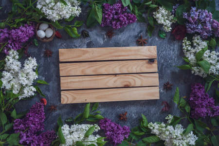 Background for greeting card greeting beloved woman wedding invitation flowers lilac on wooden surfaceの写真素材