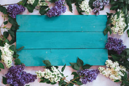 Background for greeting card greeting beloved woman wedding invitation flowers lilac on wooden surfaceの写真素材