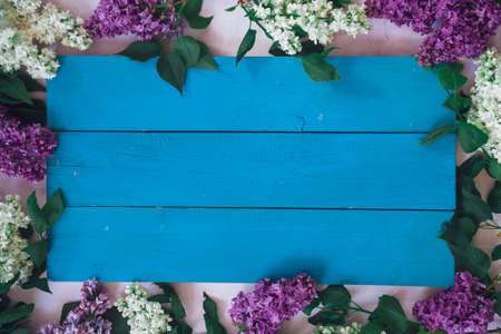 Texture background with bright flowers of lilac for the cover of the notebook diary or congratulations on the womans holidayの写真素材