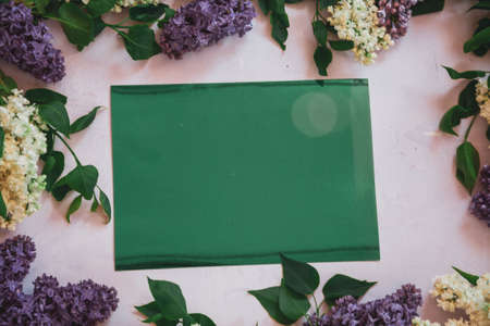 Background for greeting card greeting beloved woman wedding invitation flowers lilac on wooden surfaceの写真素材
