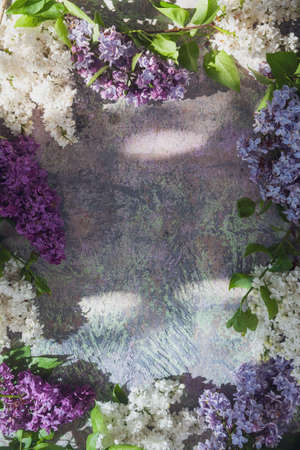 Texture background with bright flowers of lilac for the cover of the notebook diary or congratulations on the womans holidayの写真素材