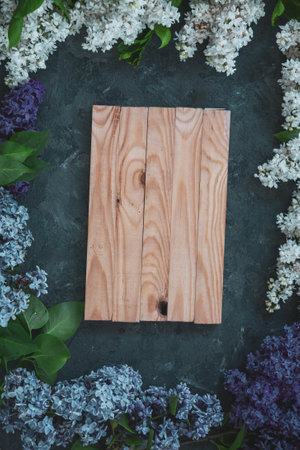 Background for greeting card greeting beloved woman wedding invitation flowers lilac on wooden surfaceの写真素材