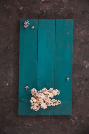 Background for greeting card greeting beloved woman wedding invitation flowers lilac on wooden surfaceの写真素材