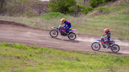 RUSSIA, Novoshakhtinsk - MAY 08, 2021: Motorcyclists ride sports cross-country motorcycles off-roadのeditorial素材