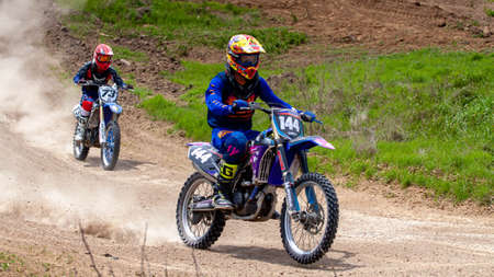 RUSSIA, Novoshakhtinsk - MAY 08, 2021: Motorcyclists ride sports cross-country motorcycles off-roadのeditorial素材