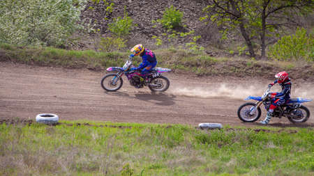 RUSSIA, Novoshakhtinsk - MAY 08, 2021: Motorcyclists ride sports cross-country motorcycles off-roadのeditorial素材