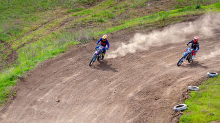 RUSSIA, Novoshakhtinsk - MAY 08, 2021: Motorcyclists ride sports cross-country motorcycles off-roadのeditorial素材