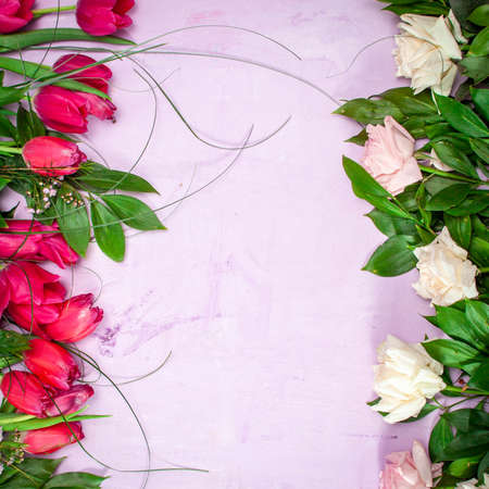 Row of red tulips on wooden background with space for message. Mothers Day background. Top viewの写真素材