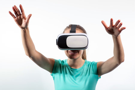 Girl in virtual reality glasses watching surprised shocking video. Young woman looking at futuristic social network map conceptの写真素材
