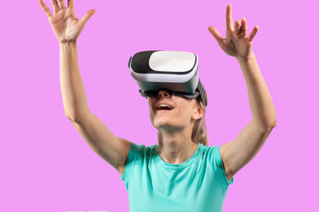 Girl in virtual reality glasses watching surprised shocking video. Young woman looking at futuristic social network map conceptの写真素材