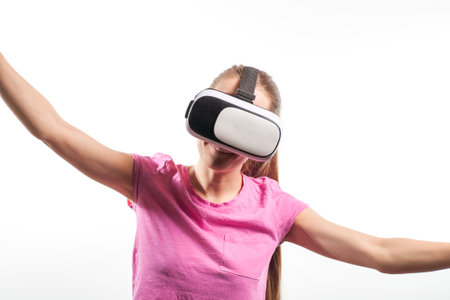 Girl in virtual reality glasses watching surprised shocking video. Young woman looking at futuristic social network map conceptの写真素材