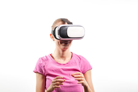 Girl in virtual reality glasses watching surprised shocking video. Young woman looking at futuristic social network map conceptの写真素材