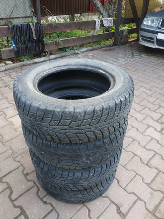 Old worn car tires. Damaged rubber. Old tyres. Recycling of rubber.の写真素材