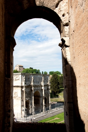 Constantine s triumphal arch through the window Colosseum, Rome, Italyの写真素材