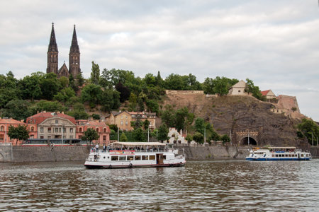 PRAGUE, CZECH REPUBLIC, JUNE 21, 2014 - Cruise ships on Vltava river under Prague Vysehrad のeditorial素材