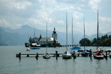 The castle of Schloss Ort in the lake Traunsee, Austriaの写真素材
