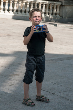 SARTENE, CORSICA, FRANCE, SEPTEMBER 03, 2016: Young boy, enthusiastic photographerのeditorial素材