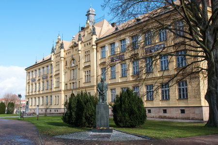 LITOVEL, CZECH REPUBLIC - NOVEMBER 19, 2017: The historical high school building built in 1901, the statue of the first president of the Czechoslovak Republic T. Masaryk in the foregroundのeditorial素材