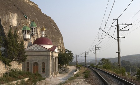 church and bell tower near the railwayの写真素材