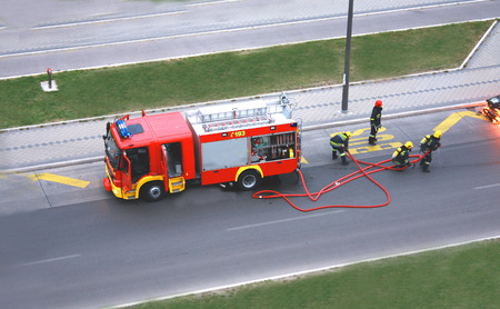 fire drill with four man who fight with the fire