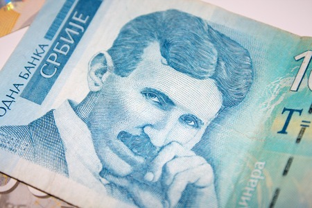 Nikola Tesla 100 dinar bill in the pile of Serbian dinars billsの写真素材
